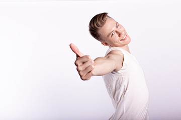 Happy man giving thumbs up sign on white background