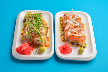 Fresh maki and nigiri sushi rolls with tuna fish and cheese. Asian Japanese cuisine concept.