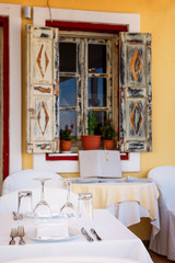 Open restaurant terrace with amazing sea view on Santorini island. Cyclades, Greece