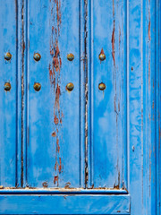 Blue wooden texture. Old wooden door on Santorini island. Cyclades, Greece.