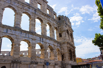 Fototapeta na wymiar Wall of the Pula Arena, the only remaining Roman amphitheatre entirely preserved, in Pula, Croatia
