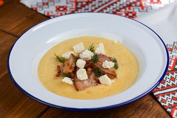 Vegetable and meat cream soup. Puree soup with meat and cheese and fresh organic dill.