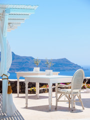 Santorini hotel terrace view. Luxury vacations. Cyclades, Greece.