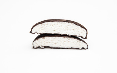chocolate-covered marshmallows cut on a white background