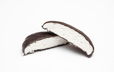 chocolate-covered marshmallows cut on a white background