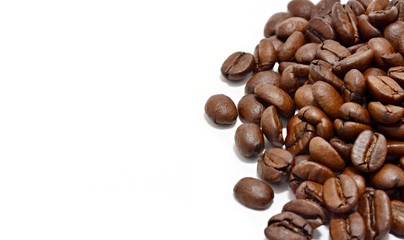 Heap of coffee beans on white background.