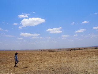 A woman walking in the great outdoors, Safari, Game Drive, Maasai Mara, Kenya
