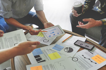 Business people writing on sticky notes for colleagues thinking strategy business plan or over...