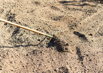 Preparing a ground with mesh to prevent weeds from growing and installing drip irrigation