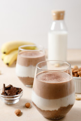 Chia seeds pudding with chocolate and banana smoothie in a glass