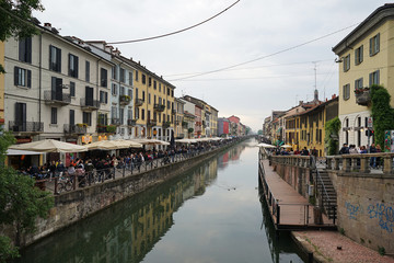 Exterior architecture and decoration of Naviglio Grande located in Navigli district, Milan's historic canal and antique market shop- Italy