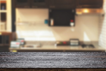 Wood desk space and blurred of kitchen background. for product display montage. business presentation.