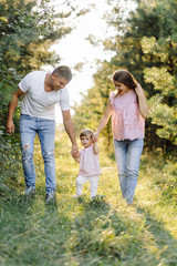 Fototapeta premium Happy family outdoors spending time together