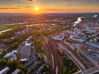 Fototapeta na wymiar Opole, aerial view of Old Town and Oder river. Poland, spring day. Drone shot on sunset time.
