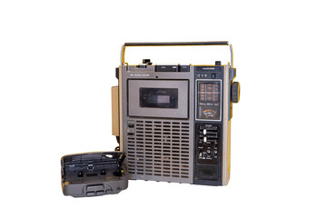 Obraz premium Isolated on white background dirty old 1970s style cassette player radio and portable cassette player.