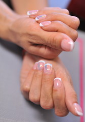 Fototapeta premium Beautiful woman's nails with beautiful manicure. Manicure work.