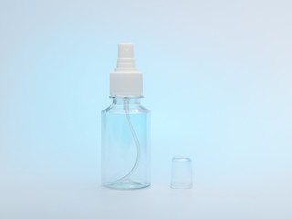 Fototapeta na wymiar transparent bottle with a spray for antiseptic against coronovirus covid19 to protect hands and surfaces from infection with the virus