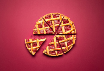 Sliced raspberry pie. Lattice crust classic pie. Raspberry tart