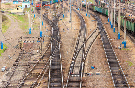 Complex Railway Station With Rail Tracks And Cargo Trains