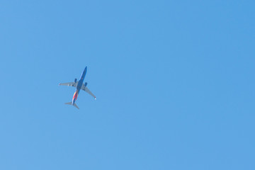 airplane flying in the sky of San Diego (USA)