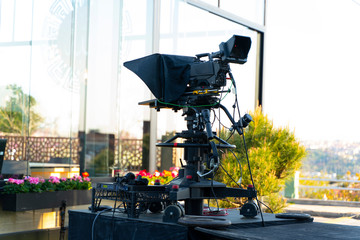 TV NEWS cast outdoors studio with camera and equipment