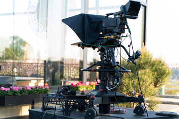TV NEWS cast outdoors studio with camera and equipment