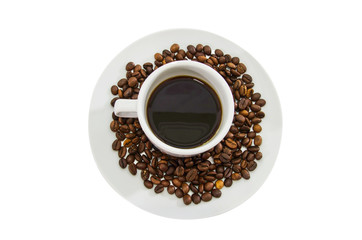 Cup with freshly brewed coffee and grains on a white background. View from above.