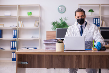Young male employee in self-isolation concept