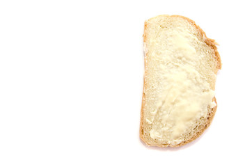 slice of loaf with butter isolated on white background. Copy space.