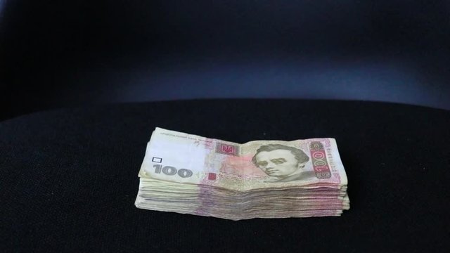 pack of banknotes on a black background