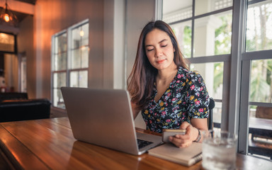 Young lifestyle beautiful Asian woman working from home using smartphone, Attraction business woman online reading communication on mobile phone, Asia business people check something new on cellphone