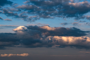 Blue sky background with big tiny stratus cirrus striped cloud before storm.