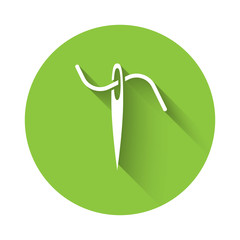 White Needle for sewing with thread icon isolated with long shadow. Tailor symbol. Textile sew up craft sign. Embroidery tool. Green circle button. Vector Illustration