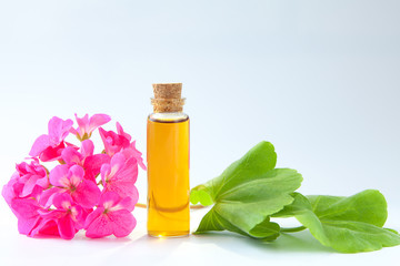 Essence of flowers on table in beautiful glass jar