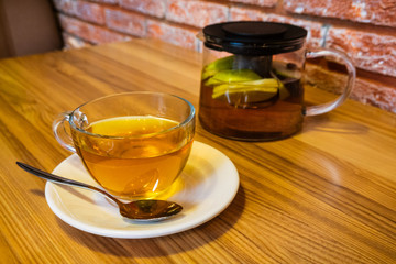 Cup and teapot filled with herbal tea