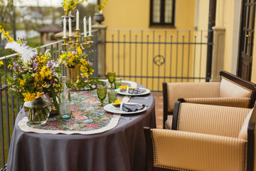 restaurant terrace decorated and table served with flowers and candles for wedding romantic dinner  