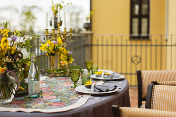 restaurant terrace decorated and table served with flowers and candles for wedding romantic dinner  