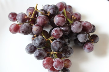 Bunch of grapes isolated on white background.