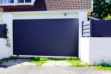 Aluminum gray paint metal gate house portal of suburb home