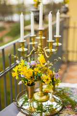 restaurant terrace decorated and table served with flowers and candles for wedding romantic dinner  
