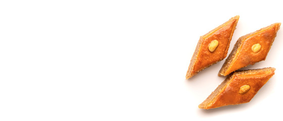 Oriental sweet baklava isolate on a white background. Selective focus.