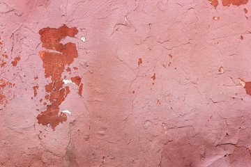 Old rough pink wall texture background.