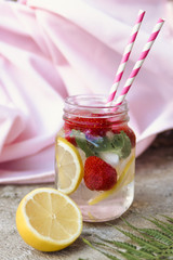 Fresh lemonade with lemon and strawberries
