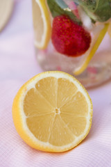 Obraz na płótnie Canvas Fresh lemonade with lemon and strawberries