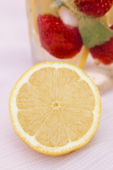 Fototapeta na wymiar Fresh lemonade with lemon and strawberries