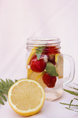 Fototapeta na wymiar Fresh lemonade with lemon and strawberries