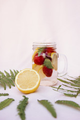 Fresh lemonade with lemon and strawberries