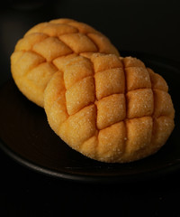 Japan style melon bun on dark black background. Bread Photography