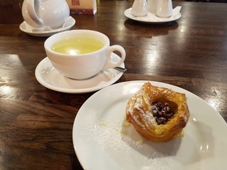 cup of green tea and croissant