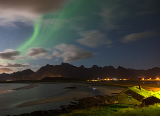 The Northern Lights over a remote beach.